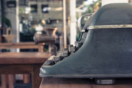 Old typewriter on wood table with copy spaceの写真素材