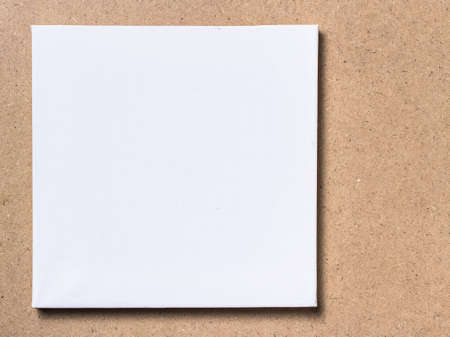 Square canvas frame on plywood backgroundの写真素材