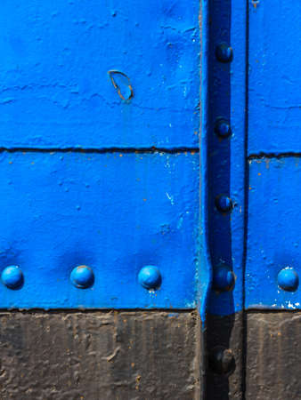Abstract blue metal background with seam and rivets on freight trainの写真素材