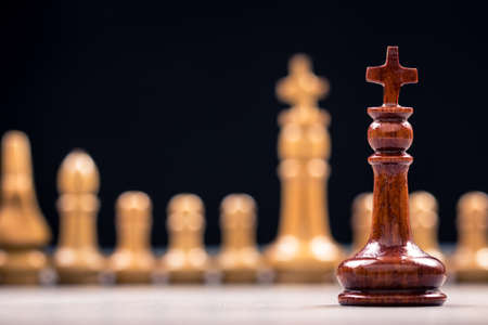 Closeup queen chess and row of competitor for business conceptの写真素材