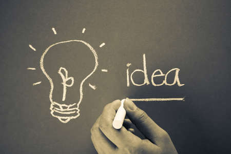 Hand underline Idea word with light bulb symbolの写真素材