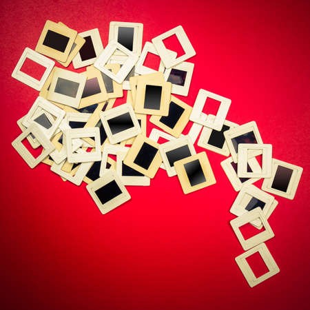 Slide film mounts on red backgroundの写真素材