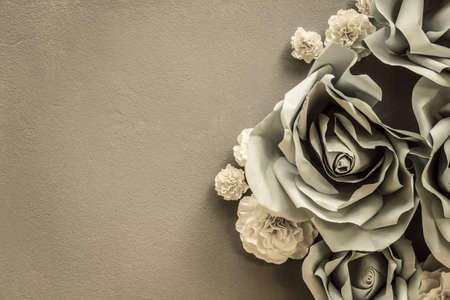 Flower origami decoration on concrete wall as vintage backgroundの写真素材