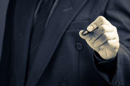 Businessman writing on screen as background for text or sketching