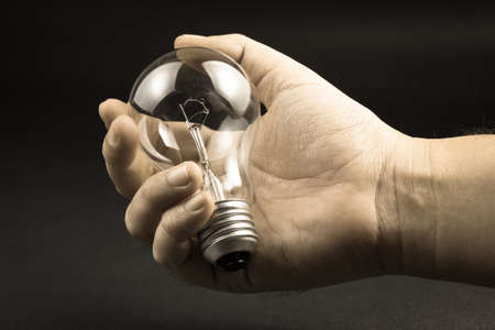 A light bulb in handの写真素材