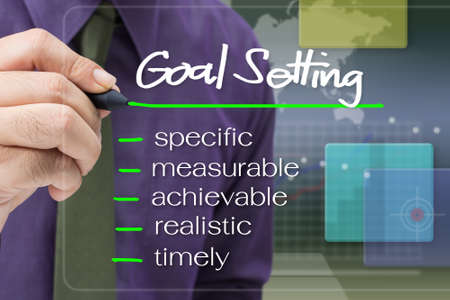 Businessman underline Goal Setting word concept on screen