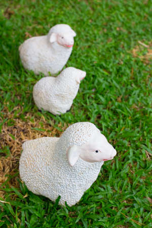 Ceramic sheep doll decorated in the gardenの写真素材
