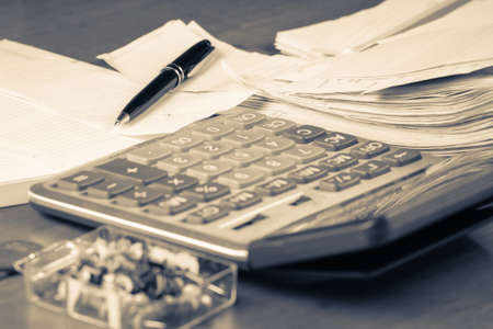 Pen on receipt with calculator in monotone colorの写真素材