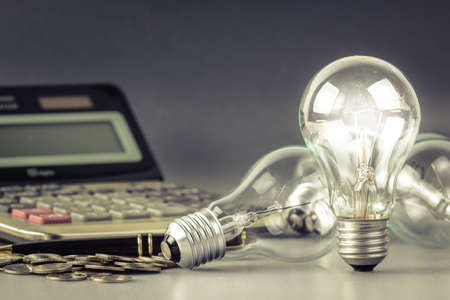 Light bulb on financial deskの写真素材