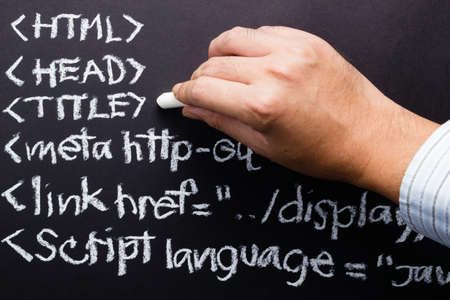 Hand writing computer source code with chalkの写真素材