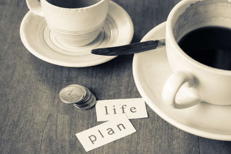 Life and plan on piece of paper, concept for planning life during coffee break