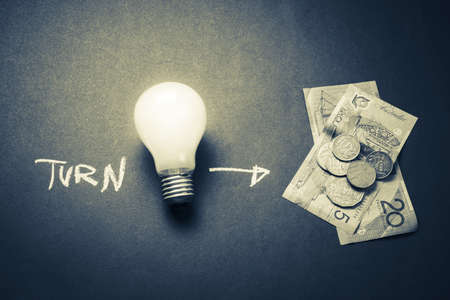 Turn idea to money concept, light bulb as symbol of creativityの写真素材