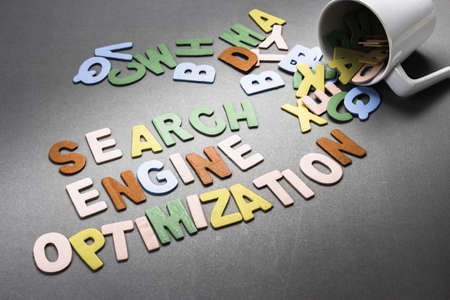 Search Engine Optimization wood letters spill out of the cupの写真素材