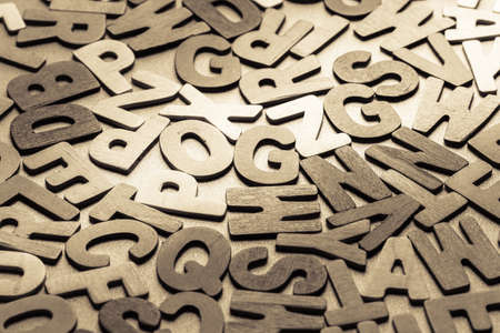 Scattered wood letters on the tableの写真素材