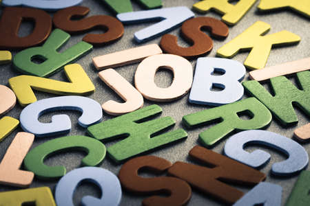 Job word in scattered wood letters