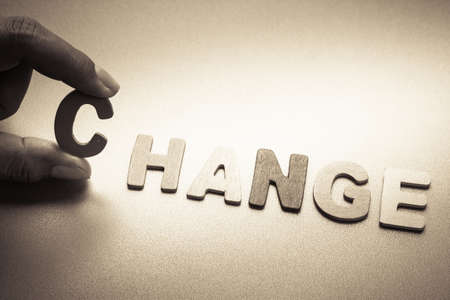 Finger pick a wood letters of Change wordの写真素材