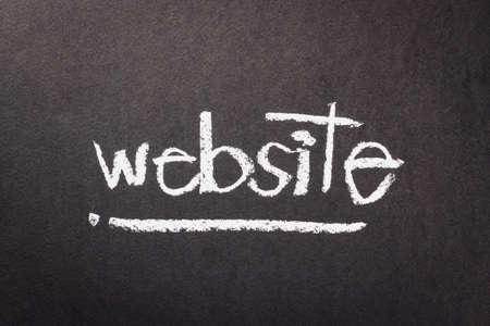 Hand writing Internet topic on chalkboardの写真素材