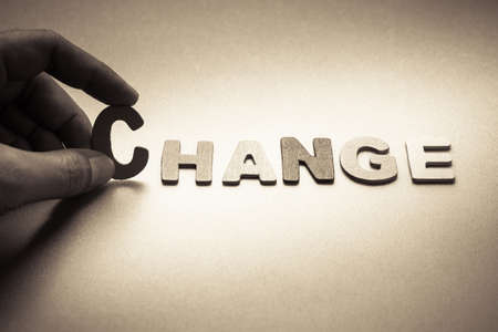 Finger pick a wood letters of Change wordの写真素材