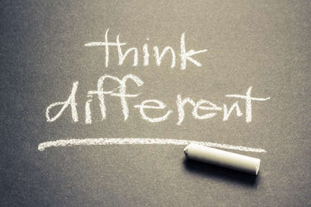 Think Different, handwriting on chalkboardの写真素材