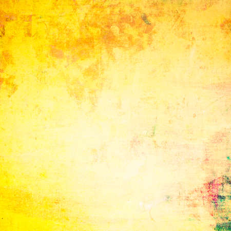 Grunge yellow painting on canvas textureの写真素材