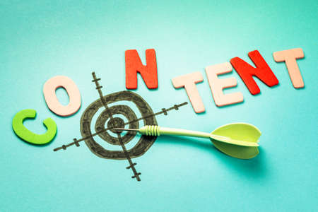 Wood letters as Content word with dart and targetの写真素材