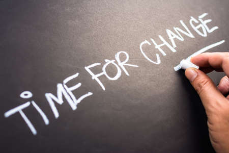 Time for Change, closeup hand writing on blackboardの写真素材