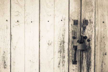 Old wood door with key locked
