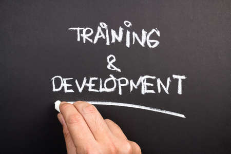 Hand writing Training and Development topic on chalkboardの写真素材