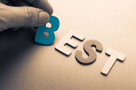 Hand arrange wood letters as Best wordの写真素材
