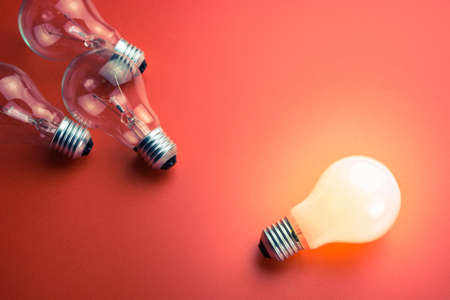 White light bulb is glowing different from the othersの写真素材