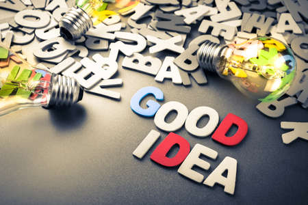 Wood letters as Good Idea word with light bulbs on  scattered lettersの写真素材