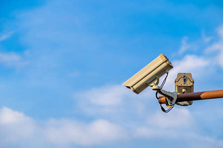 CCTV Camera on the post with clear blue skyの写真素材