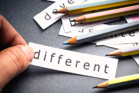 Closeup hand pick a piece of paper from the pile, Different topic conceptの写真素材