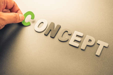 Hand arrange wood letters as Concept wordの写真素材