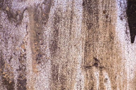 Dirty oil stain on metal tank of freight train, grunge background