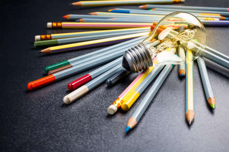 Light bulb with many pencilsの写真素材