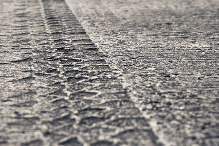 Tire track printed on cement roadの写真素材