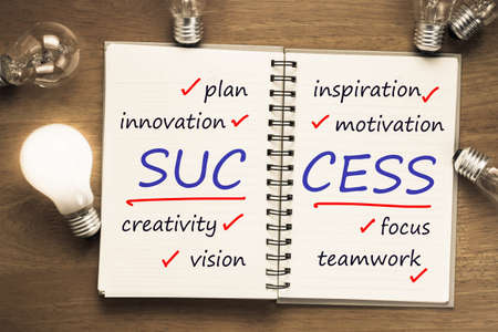 Success factor as memo on notebook with light bulbsの写真素材