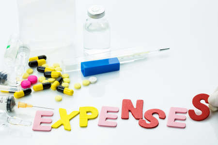 Medical Expenses word with medicine and equipments