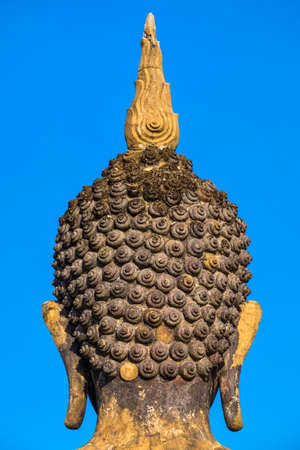 Spiral detail of ancient Buddha statue, back of headの写真素材