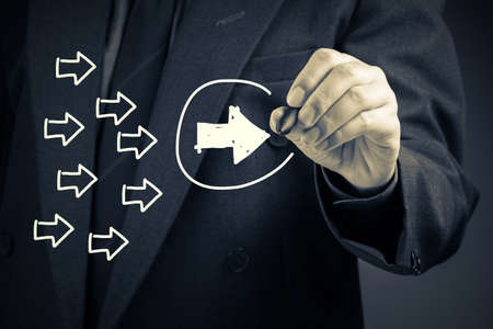 Businessman draw an white arrow as trend leader or leadership concept on screenの写真素材