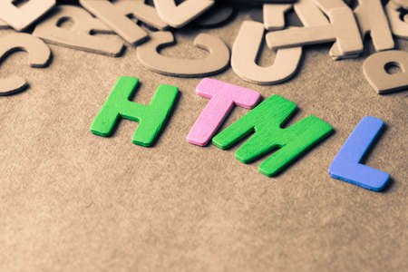HTML (Hypertext Markup Language) abbreviation in scattered wood lettersの写真素材