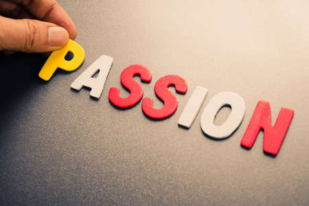 Hand arrange wood letters as Passion wordの写真素材