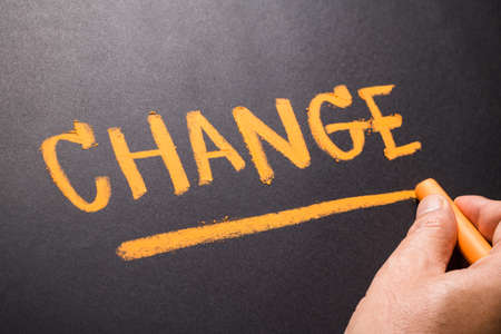 Hand write Change word on chalkboardの写真素材