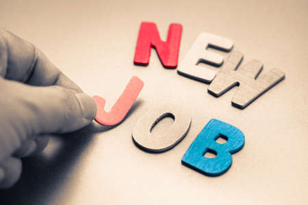 Hand arrange wood letters as New Jobの写真素材