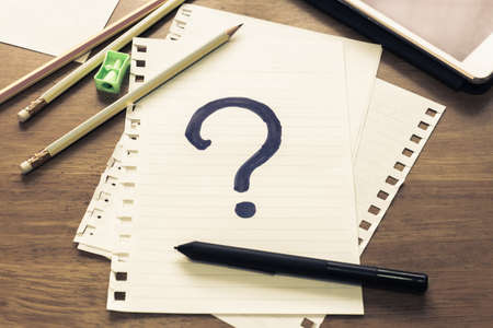 What's Your Story, Question Mark on papers with many pencilsの写真素材