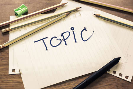 Topic text handwriting on papers with many pencilsの写真素材