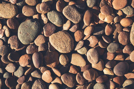 Pebbles in sunlight, retro color styleの写真素材