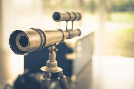 Antique brass spyglass in vintage colorの写真素材