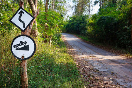 Old signpost along the road in the forestの写真素材